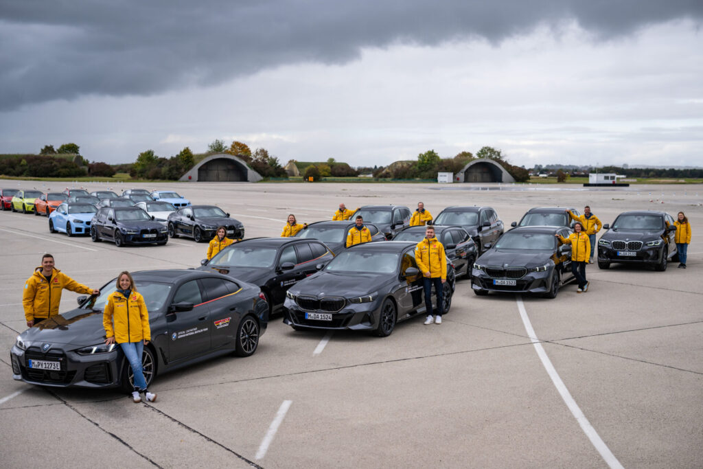 MAISACH, GERMANY - OCTOBER 10: The german biathlon team is posing for a picture on side of there new bmw cars, a BMW i4 M50, BMW 520d xDrive Touring, BMW 330d xDrive Touring, BMW X4 xDrive30d and BMW X3 during the BMW Car handover to the German Ski Federation before the Season 2024/25 at the BMW Driving Academy on October 10, 2024 in Maisach near Munich, Germany. (Photo by Kevin Voigt/VOIGT for BMW)