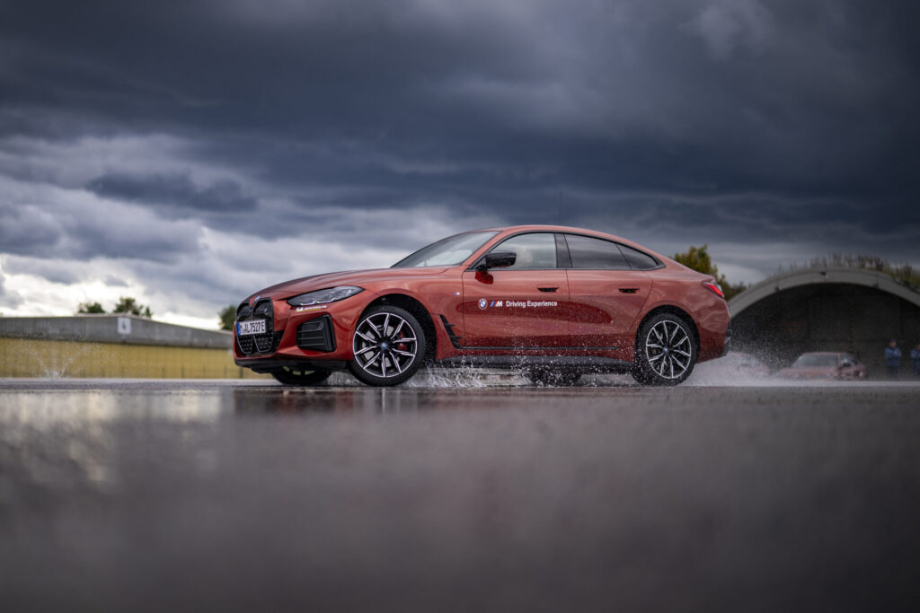 MAISACH, GERMANY - OCTOBER 10: A BMW i4 eDrive40 drifts during the BMW Driving Experience after the car handover to the German Ski Federation before the Season 2024/25 at the BMW Driving Academy on October 10, 2024 in Maisach near Munich, Germany. (Photo by Kevin Voigt/VOIGT for BMW)