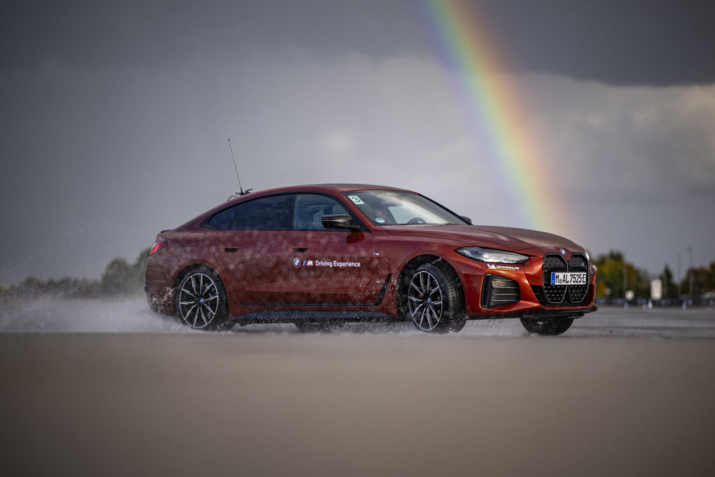 MAISACH, GERMANY - OCTOBER 10: A BMW i4 eDrive40 drifts during the BMW Driving Experience after the car handover to the German Ski Federation before the Season 2024/25 at the BMW Driving Academy on October 10, 2024 in Maisach near Munich, Germany. (Photo by Kevin Voigt/VOIGT for BMW)