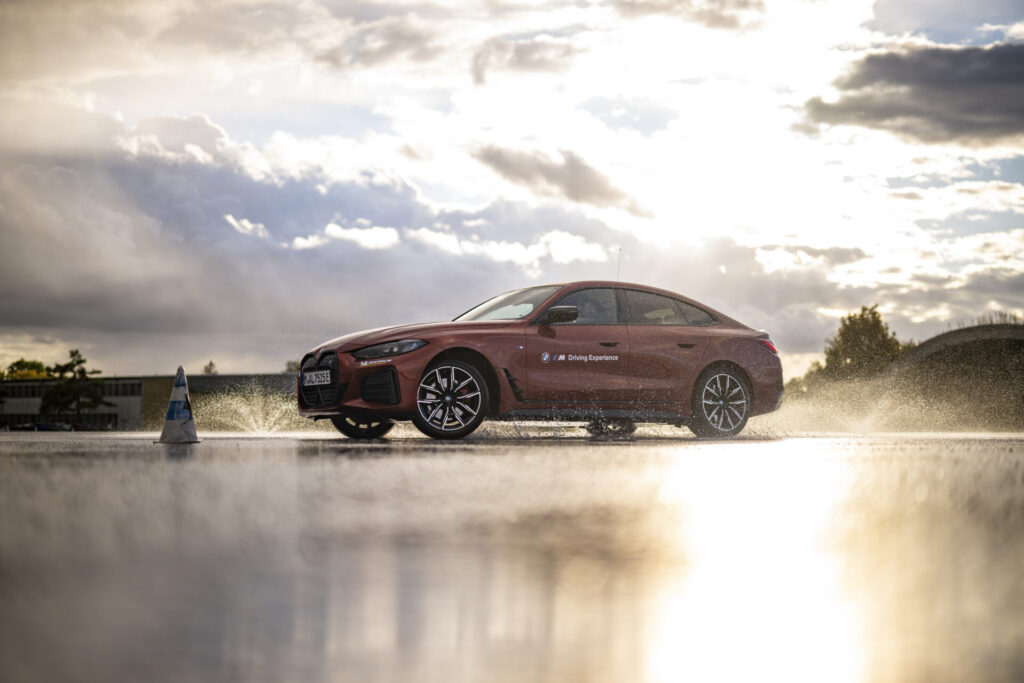 MAISACH, GERMANY - OCTOBER 10: A BMW i4 eDrive40 drifts during the BMW Driving Experience after the car handover to the German Ski Federation before the Season 2024/25 at the BMW Driving Academy on October 10, 2024 in Maisach near Munich, Germany. (Photo by Kevin Voigt/VOIGT for BMW)