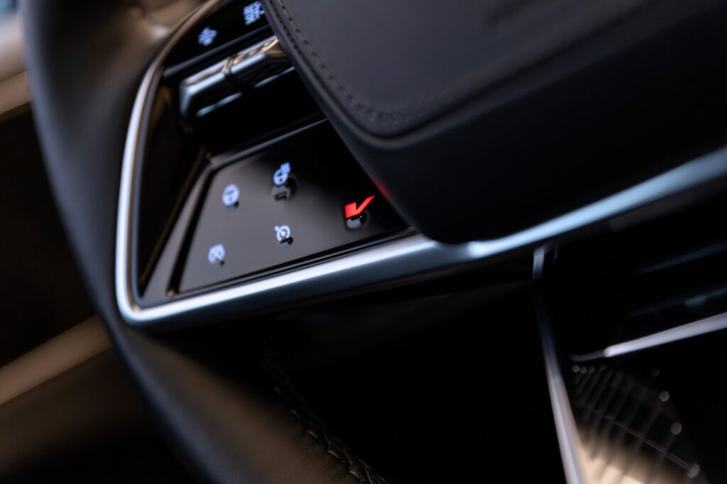 Detail shot of the Cadillac LYRIQ-V’s steering wheel